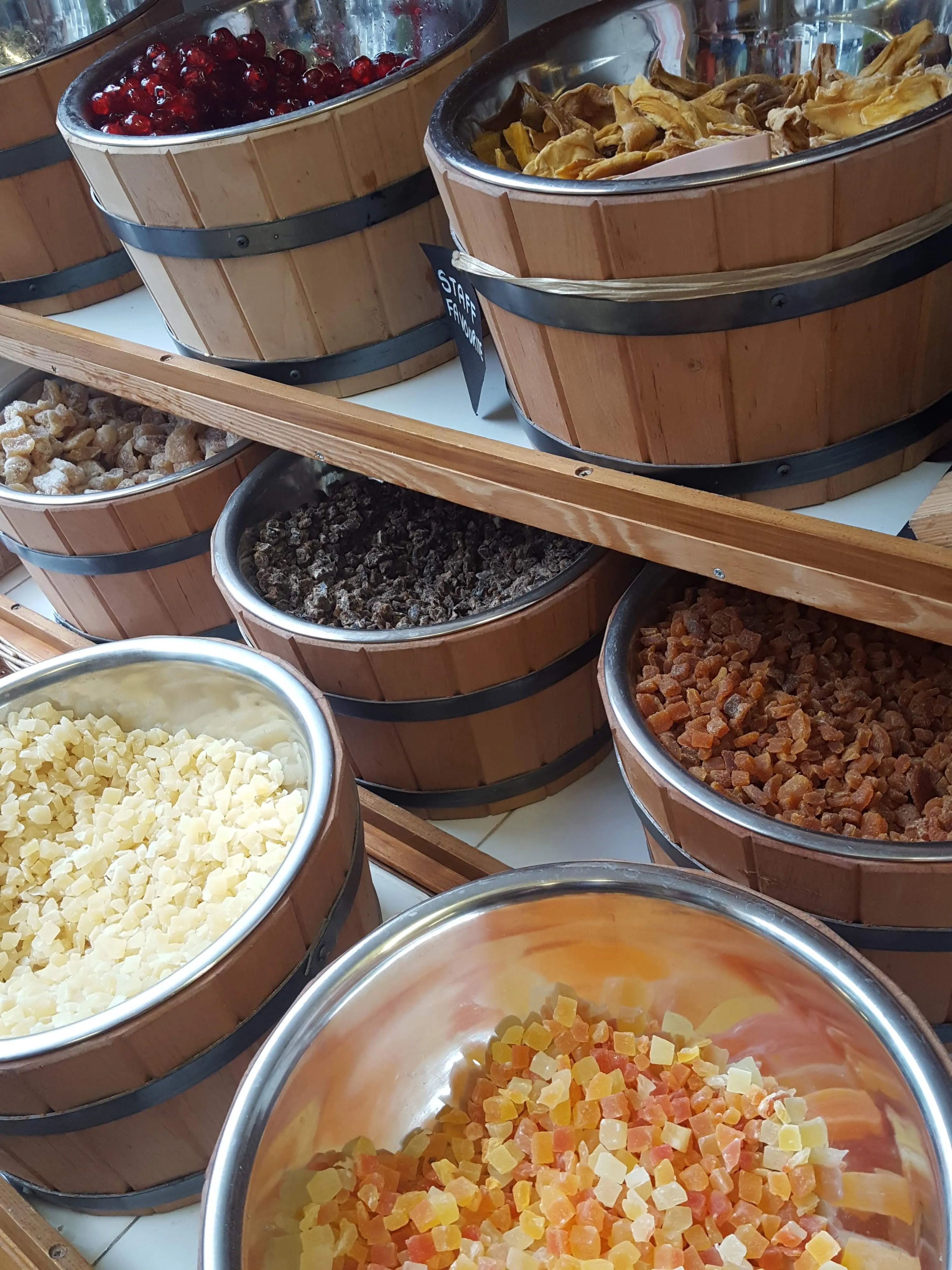 Refill barrels of dried fruit and grains inside Spill the Beans, seen from above